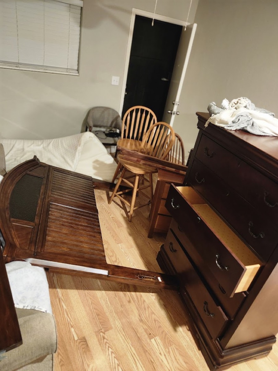 Bedroom furniture staged for removal from inside a Phoenix home