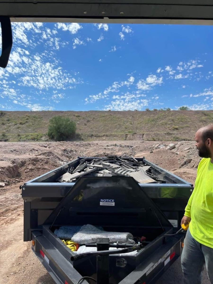 M and G Junk Removal trailer loaded with construction debris