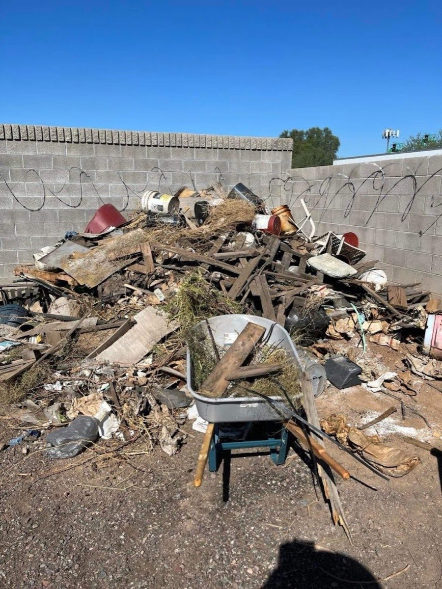 Pile of junk and yard debris before removal in Phoenix